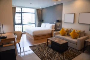 Rooms in Vellore featuring a king bed and city view seating area at JK Inn
