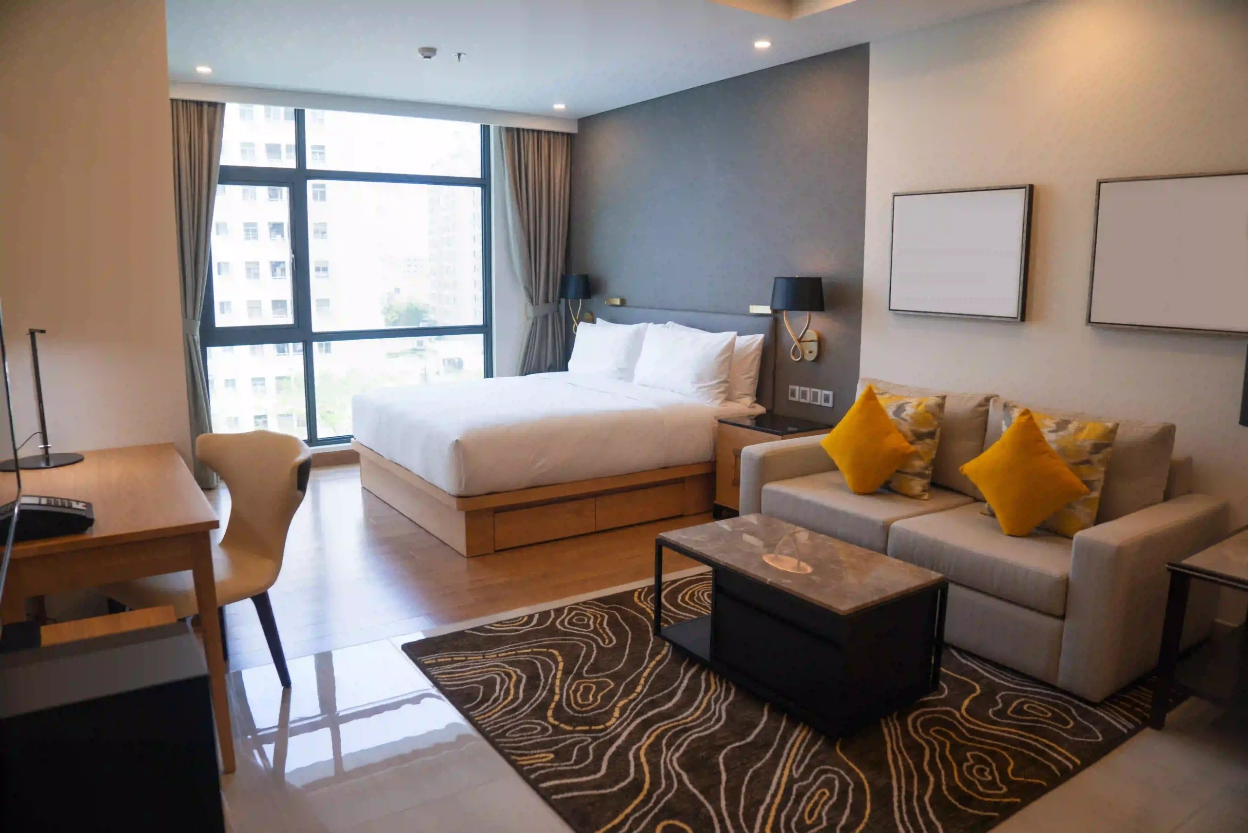 Rooms in Vellore featuring a king bed and city view seating area at JK Inn