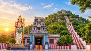 Theerthagiri Murugan Temple Vellore entrance with Murugan statue and hillside steps at sunrise